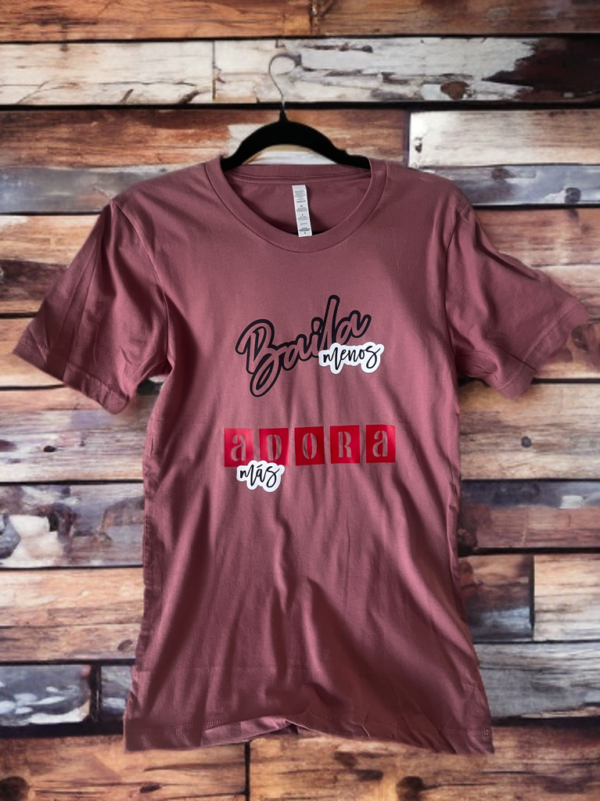 Baila menos y adora mas message on t-shirt