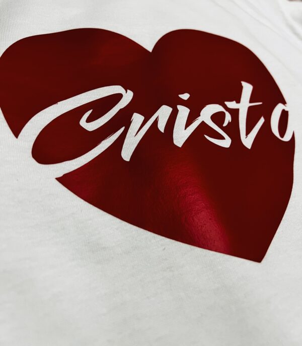 close up of a white t-shirt with a red heart on the middle