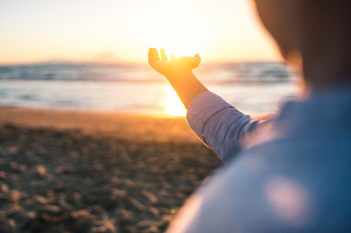 person holding the sun christian apparel saving lives