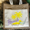 image of a beach bag for summer with the phrase beach on purple